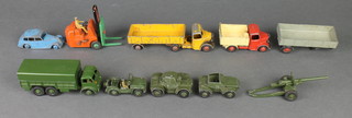 A Dinky Supertoy 410 Army truck, a no. 670 armoured car (f), a no. 674 Austin Champ (f), a field gun, 3 military vehicles, a Dinky forklift truck and other vehicles
