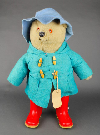 A Paddington bear with blue duffle coat and hat 