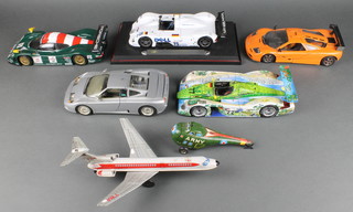 A Japanese tin plate model of a TWA Boeing aircraft, 2 Maisto model racing cars, 3 other model racing cars etc 