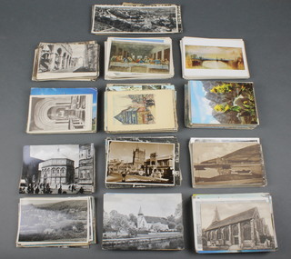 A collection of various black and white and coloured postcards