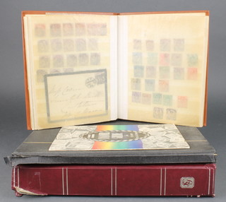 A brown stock book containing various penny reds, a black Stanley Gibbons stock book of used World stamps,  a red ditto of used GB stamps