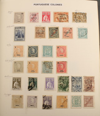 An album of mint and used stamps of the Portuguese Colonies - Guinea, Portuguese India, Puerto Rico, Qatar Reunion, Rhodes, Ruanda-Urundi etc 