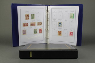 An album of Brazilian mint and used stamps 1957 and an album of Liberia stamps 1980-1989 and an album of mint and used Belgian stamps 1976-2004