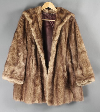 A lady's brown fur coat 