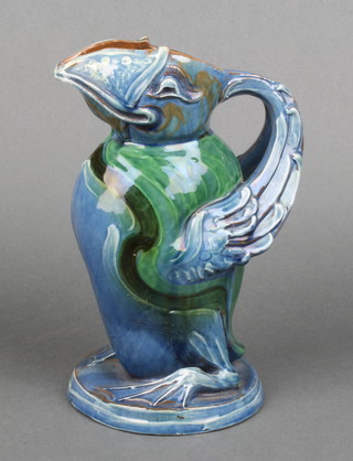 A CH Brannam Barum moulded jug in the form of a grotesque bird inscribed 1899 8" 