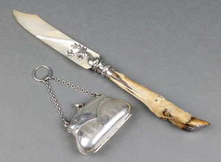A silver engine turned novelty purse on chain, a silver mounted mother of pearl paperknife 