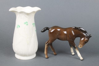 A Belleek vase with clover leaf decoration and brown marks 6", a Beswick figure of a standing foal 4" 