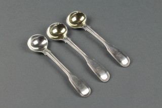 A pair of Victorian silver reeded fiddle pattern mustard spoons London 1840, one other 86gr