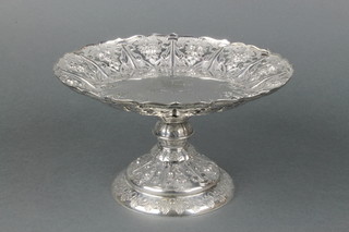 A good Victorian heavy gauge silver tazza with repousse fruit floral and armorial decoration, Sheffield 1883 Frederick Elkington inscribed Jays 142-144.Oxford St W Silversmiths