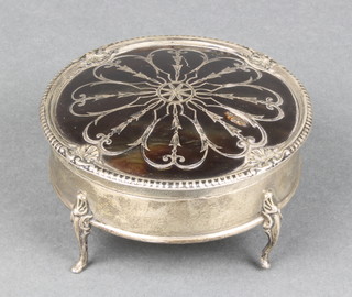 A silver and tortoiseshell pique circular trinket box on scroll feet, Birmingham 1913, 3 3/4" 