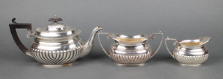 A gentleman's silver plated demi-fluted 3 piece breakfast tea set with ebonised mounts