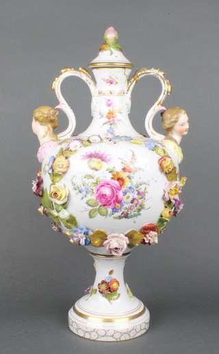 A 20th Century German porcelain 2 handled vase with  panels of classical figures and flowers, with scroll handles and figural terminals with applied flowers 18"
