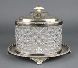 An Edwardian silver plated mounted cut glass biscuit barrel with ivory knop on a ditto base with scroll feet 10" 