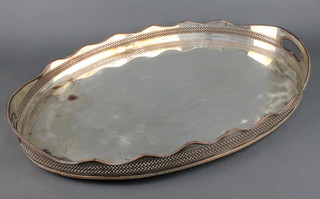 An oval silver plated pierced galleried 2 handled tray 24" 