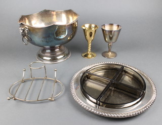 A silver plated punch bowl with lion ring handles and minor plated items 