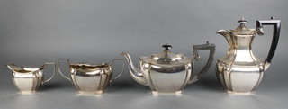A silver plated octagonal 4 piece tea set with ebonised mounts 