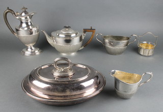 A silver plated 4 piece demi-fluted tea set with ebonised mounts and 2 other items