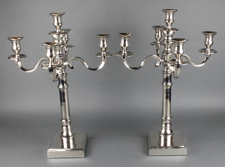 A pair of plated 5 light candelabrum on square bases 22" 