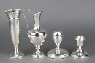 A silver tapered posy vase Birmingham 1955 6", 2 chamber sticks and a sterling ewer 