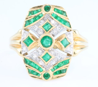 An 18ct yellow gold emerald and diamond up finger Art Deco style ring, size R 1/2