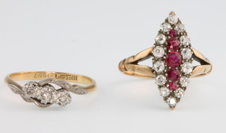 An 18ct ruby and diamond up finger ring, size M, an 18ct yellow gold 3 stone diamond size L