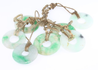 A jade 7 plaque necklace with pierced flattened beads 
