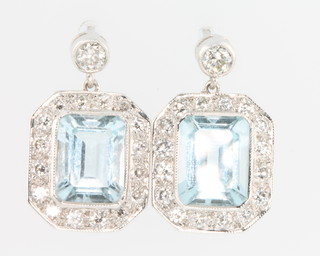 A pair of 18ct white gold aquamarine and diamond octagonal drop earrings, the centre stones approx. 4.2ct surrounded by brilliant cut diamonds 
