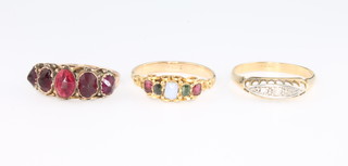 An 18ct yellow gold diamond ring size O 1/2, an 18ct gold gem set ring size N and a garnet ditto size N