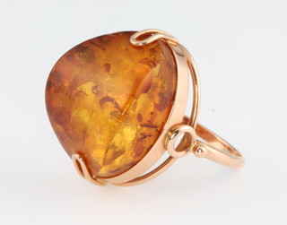 A yellow gold treated amber dress ring, size J 
