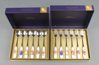 2 cased sets of Royal Worcester Evesham Gold spoons and forks with porcelain handles