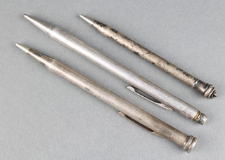 A silver propelling pencil and 2 plated ditto