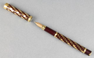 A lady's 1970's Waterman fountain pen with chequer decorated barrel and 18ct nib