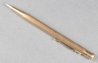 A 9ct gold yellow gold engine turned yard o'lead propelling pencil