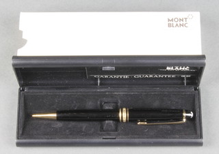 A boxed Mont Blanc propelling pencil with guarantee