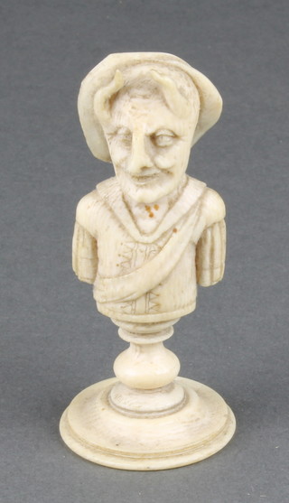 A 19th Century carved bone chess piece? in the form of a grotesque figure with horns 3 1/4" 