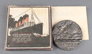 A boxed Lusitania medal with original paper work 