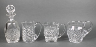 A cut crystal  mallet shaped decanter and stopper 9", 3 cut glass jugs 