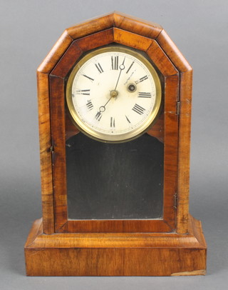 An American shelf clock with painted dial and Roman numerals contained in a walnut case