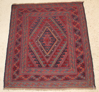 A contemporary red and blue ground tribal Gazak rug with diamond to the centre 46" x 42" 
