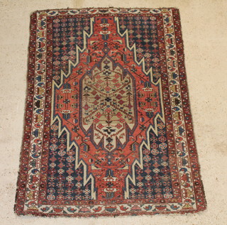 A Persian Mazlegan rug with stylised diamond to the centre 73" x 52" 