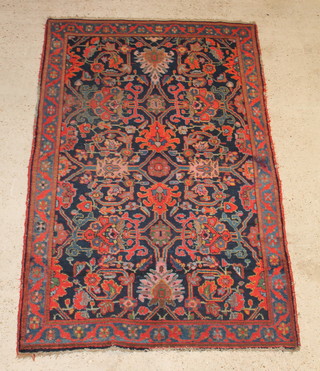 A blue and red floral ground Ziegler Mahal rug 85" x 53" 
