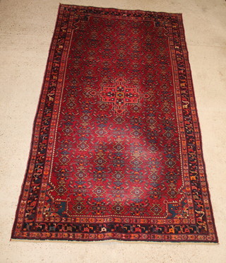 A red and blue ground Persian Brojerd carpet 122" x 66" 
