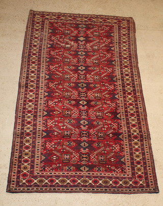 A red and blue ground Caucasian carpet with wear and wear to the edge 106" x 61" 
