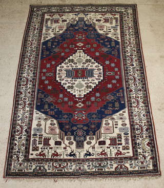 A blue and white ground Turkish carpet with with central medallion decorated animals 105" x 67" 