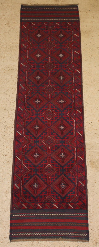 A Meshwani blue and red ground runner with 14 octagons to the centre 100" x 26" 