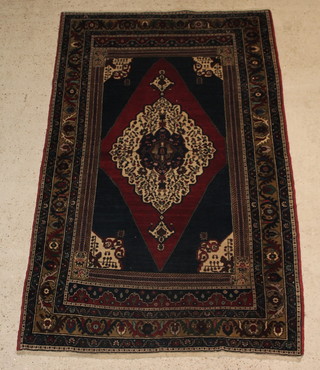 A blue and red ground Turkish rug with diamond shaped lozenge to the centre 87" x 55"  
