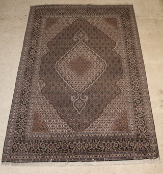 A blue ground Persian carpet with central medallion 119" x 79" 