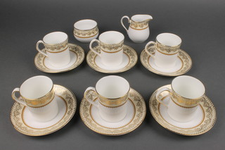 An Elizabethan Staffordshire coffee set comprising 6 cans, 6 saucers, cream jug and sugar bowl 