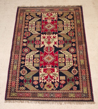 A blue ground rug with Caucasian style decoration 79" x 56" 