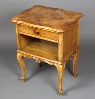A French Kingwood bedside cabinet with three-quarter veneered and crossbanded top, fitted a drawer above a recess, raised on carved cabriole supports 20"h x 16"w 